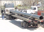 Industrial chimney loaded on a flat bed trailer
