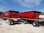 25yd roll-taro containers loaded on flat-bed